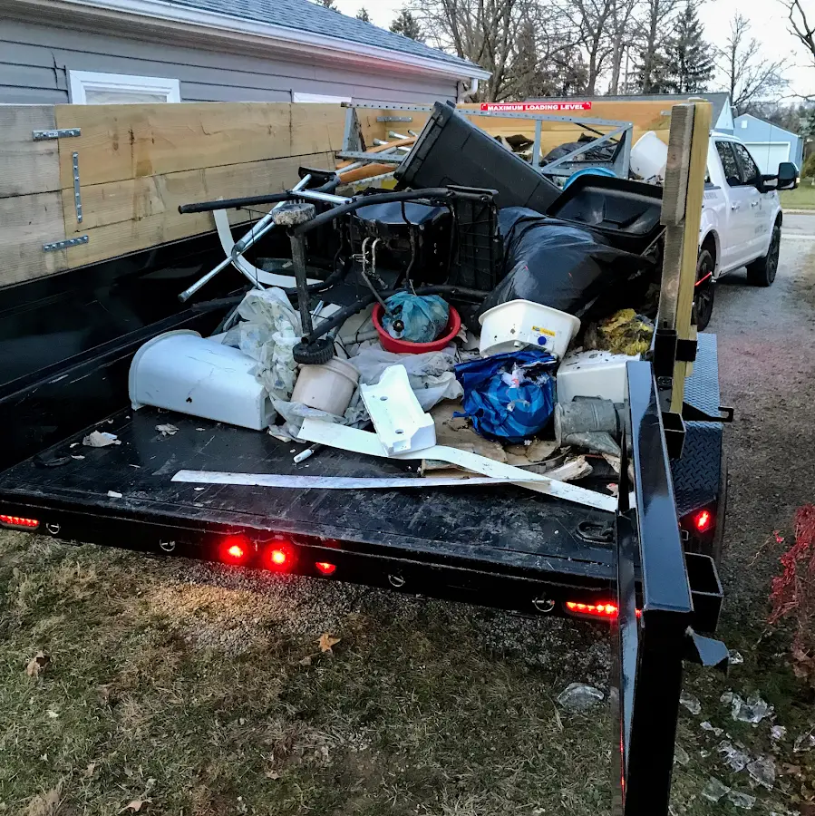 Roll-off dumpster delivered to a residential driveway in Lake Park